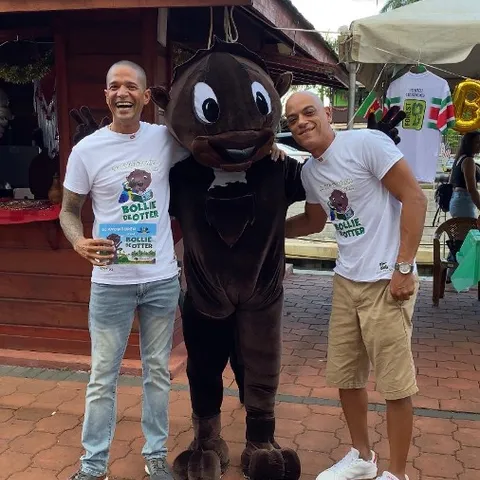 Author Dave van Aerde and Bollie designer Jamie Ferrier with Bollie the Otter at the book launch