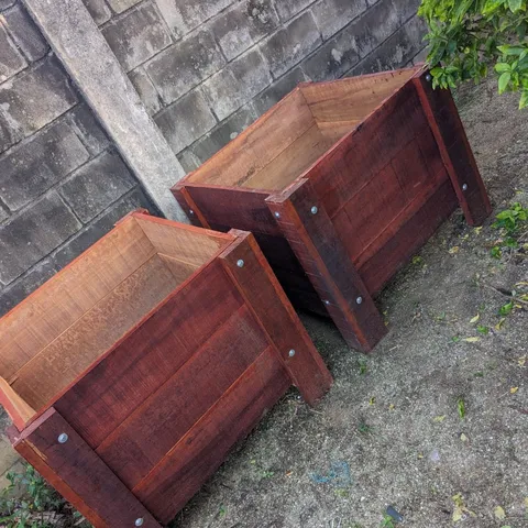 Two newly built wooden planter boxes