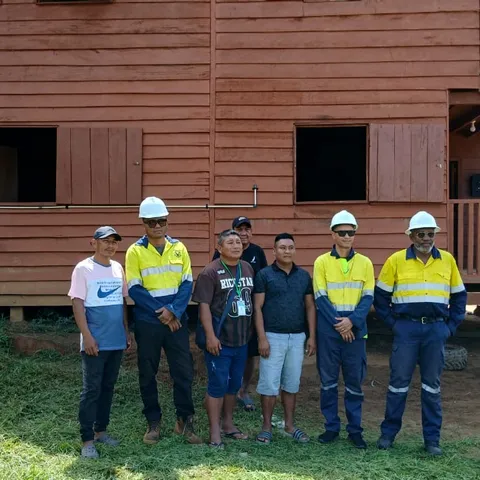 The installation team and villagers in front of the Tewe office after the solar fit-out