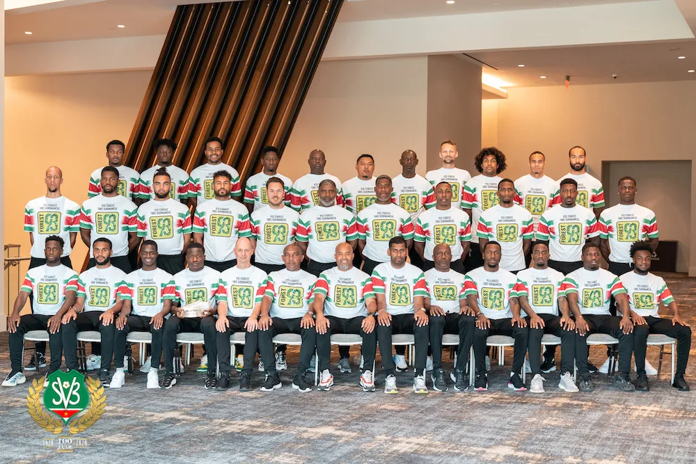 Team photo of Suriname's national football squad in their Forest93 Gold Cup shirts